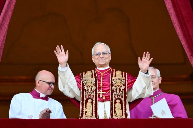 Pope Leo XIV addressing the crowd after election, representing leo 13's significance in Catholic history.