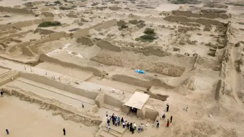 View of the ancient adobe walls of Chan Chan Peru