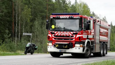 Emergency vehicles at helicopter crash site in Eura, Finland